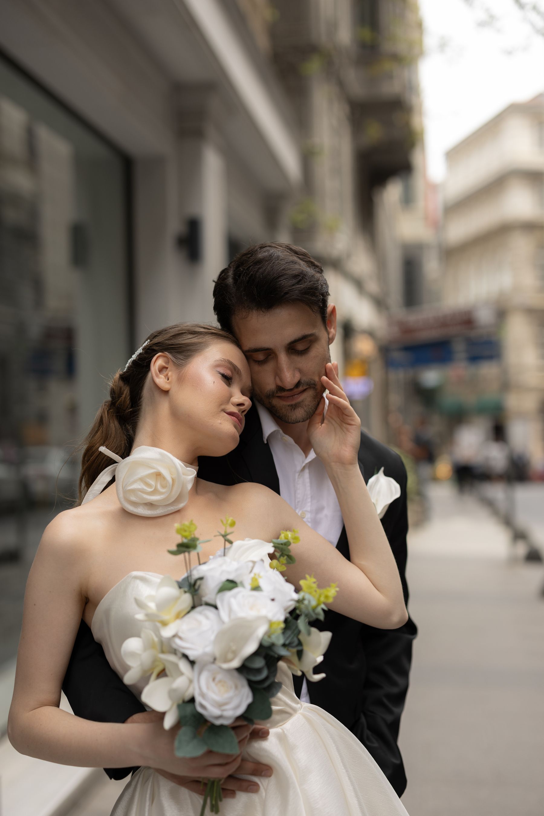 Newly married couple together on a city street